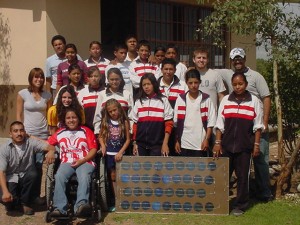 Install a solar electric system at a school so students can use a computer